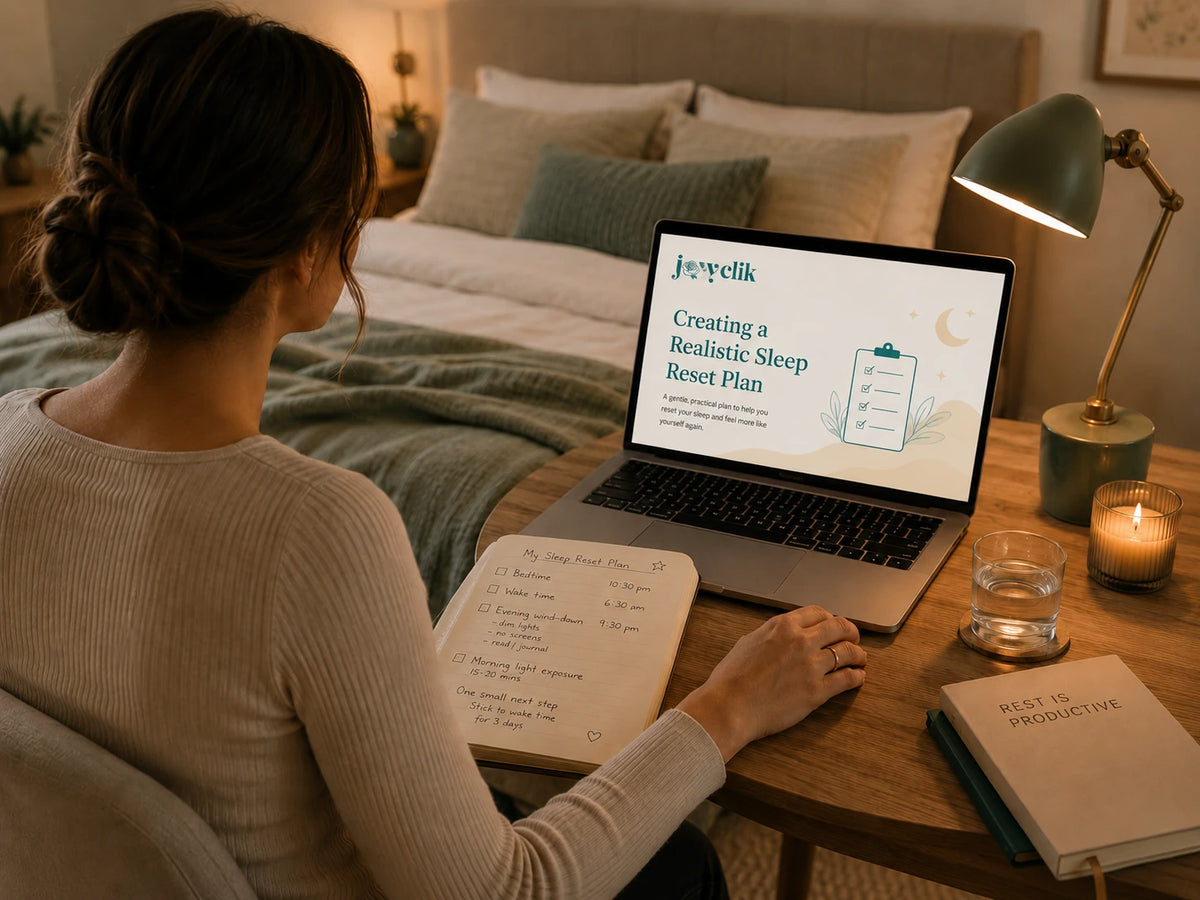 Calm JoyClik sleep reset planning workspace with journal, soft evening light, and restful atmosphere