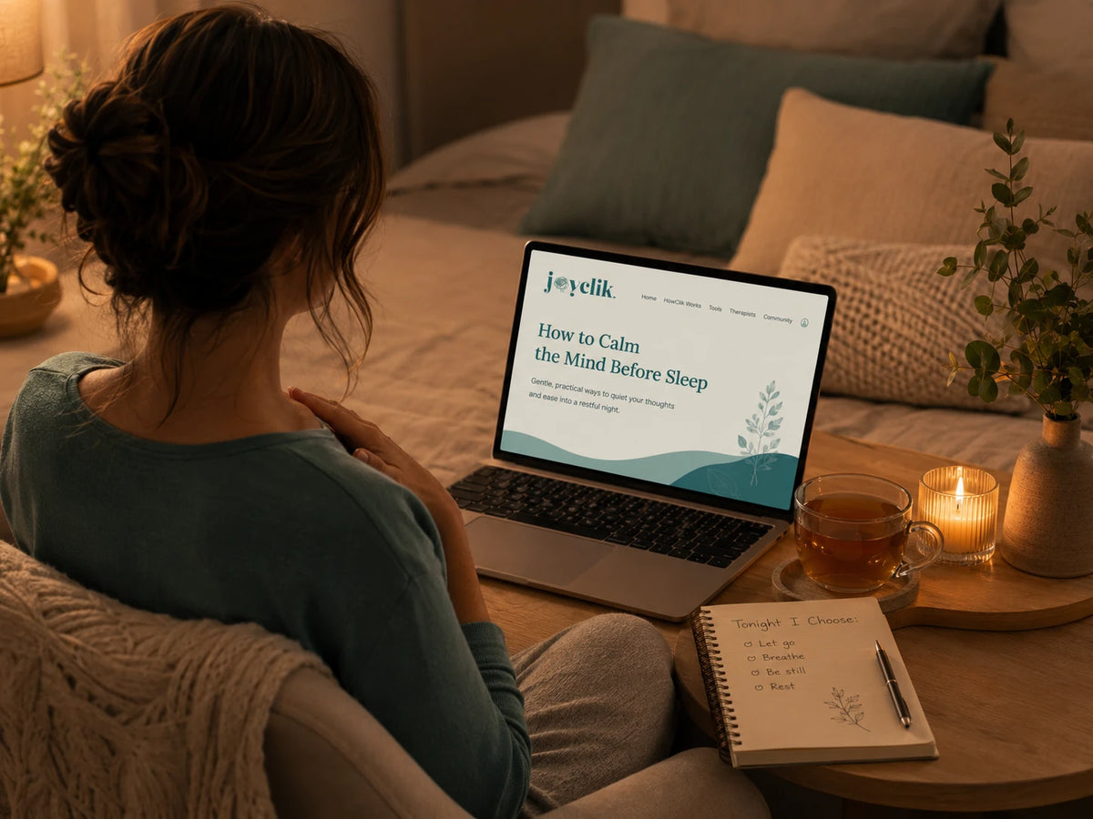 Calm JoyClik sleep workspace with journal, soft evening light, and quiet wind-down setting